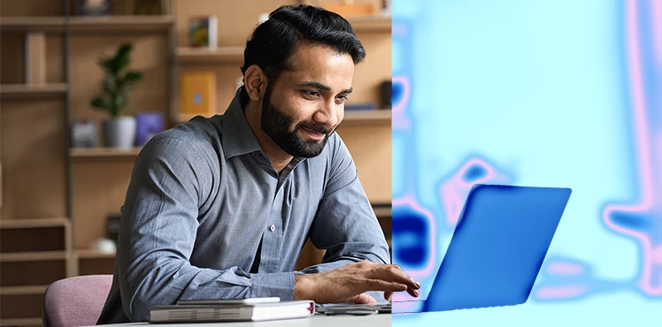 Man-with-smile-on-face-working-with-laptop-2-1